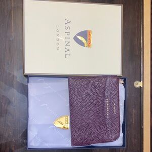 ASPINAL OF LONDON.Burgundy Leather Pouch
